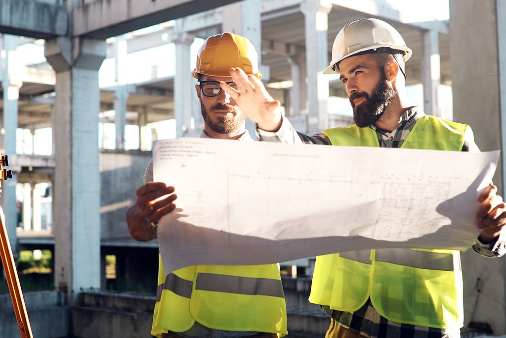 General Contractors checking the plan map details