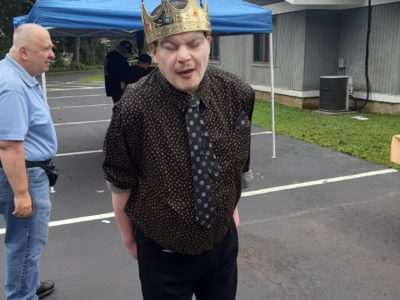 John wears birthday crown